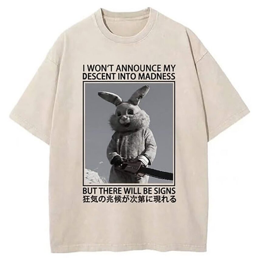 A t-shirt with a photo of somebody in a rabbit costume holding a chainsaw with the caption "I won't announce my descent into madness but there will be signs".