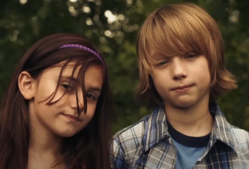 The video of Stay Young, Go Dancing starts out with a couple in their old age and shows you their lives backwards as until they are pre-teens. These are the pre-teen version of the couple.