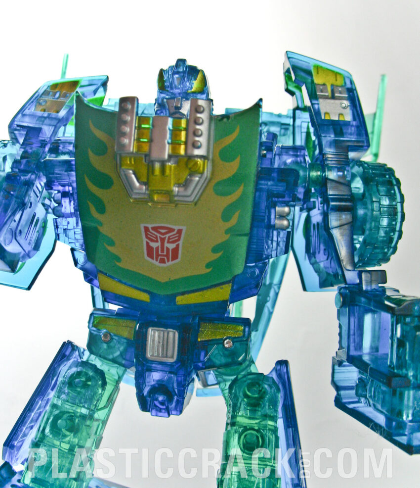 I suppose that E-Hobby was going for that moment in TF: The Movie when opening the matrix starts to reformat Hot Rod into Rodmimus Prime. They often try to make the redecos make sense within established fiction.