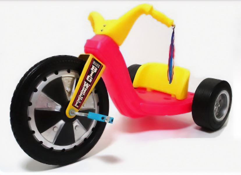 Image of a 1970's red and yellow Big Wheel plastic tricycle.