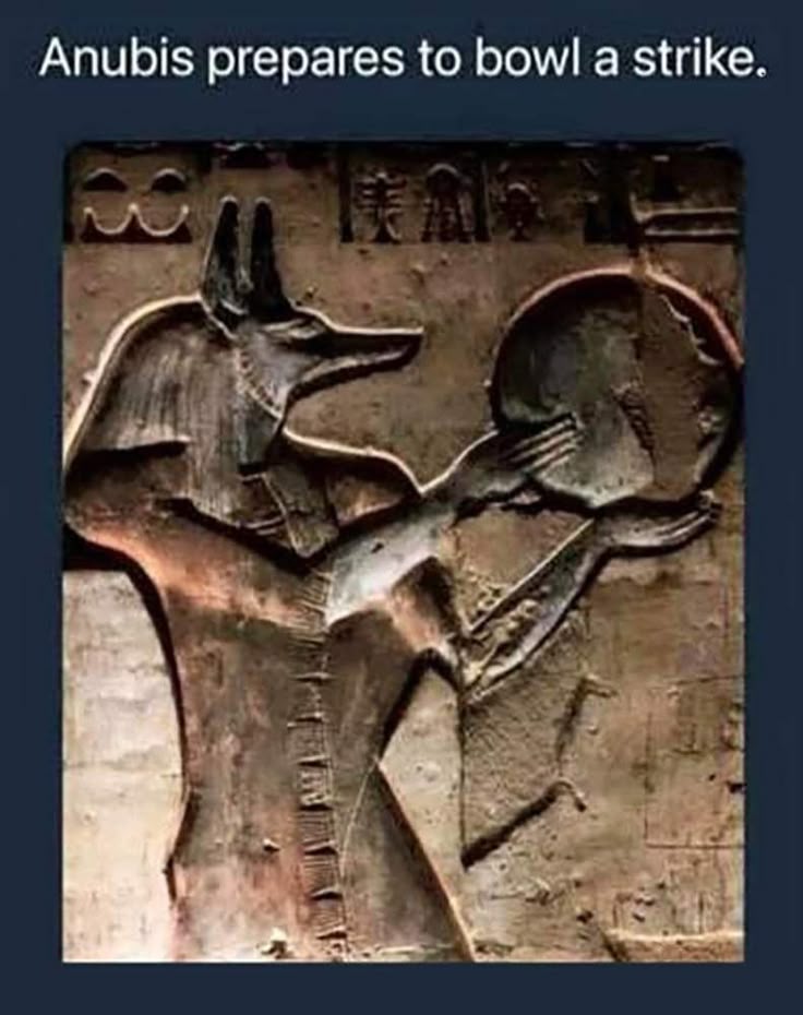 An bas-relief image from Ancient Kemet of Anubis (Anpu) holding up a large disk, similar or potentially the Aten (sun disk) but the caption reads "Anubis prepares to bowl a strike".