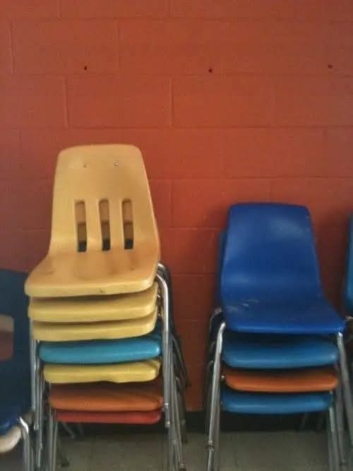Picture of 2 chairs. One seat is yellow. The other blue. And vaguely symbolize Tweek and Craig!