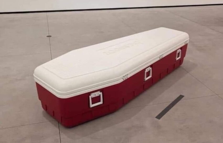 A picture of an ice cooler in the shape of a casket/coffin.