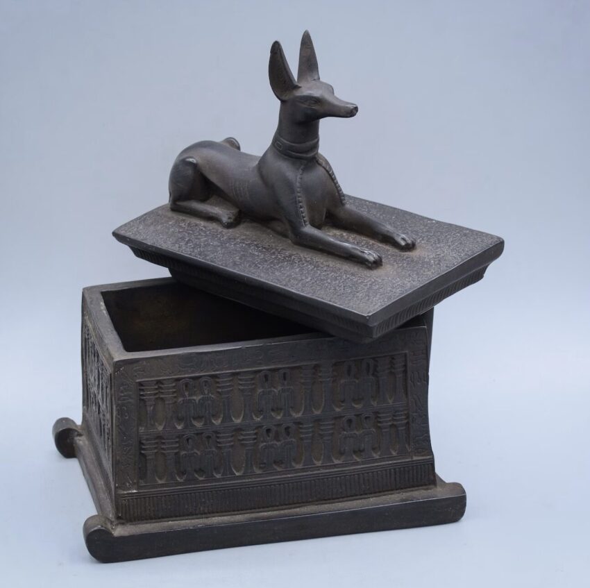 An image of a small reproduction Anubis shrine. THe original was discovered in tomb KV62 belonging to Pharaoh Tutankhamun. Unpainted.