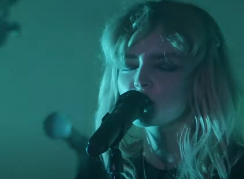 Video still of Lauren Mayberry from CHVRCHES performing the song "The Killing Moon".